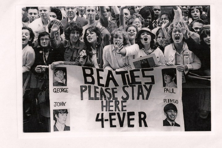 a vintage photo of a group of people posing for the camera