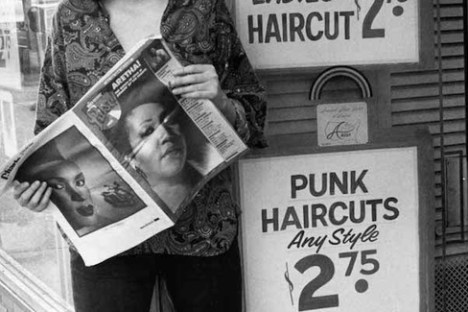 Aretha Franklin holding a sign